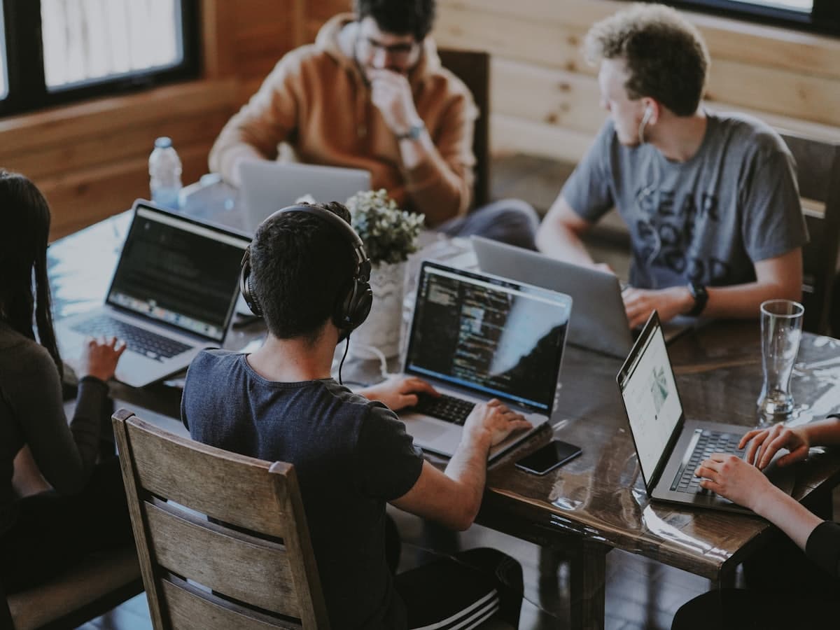 Techiedoods team collaborating around a desk